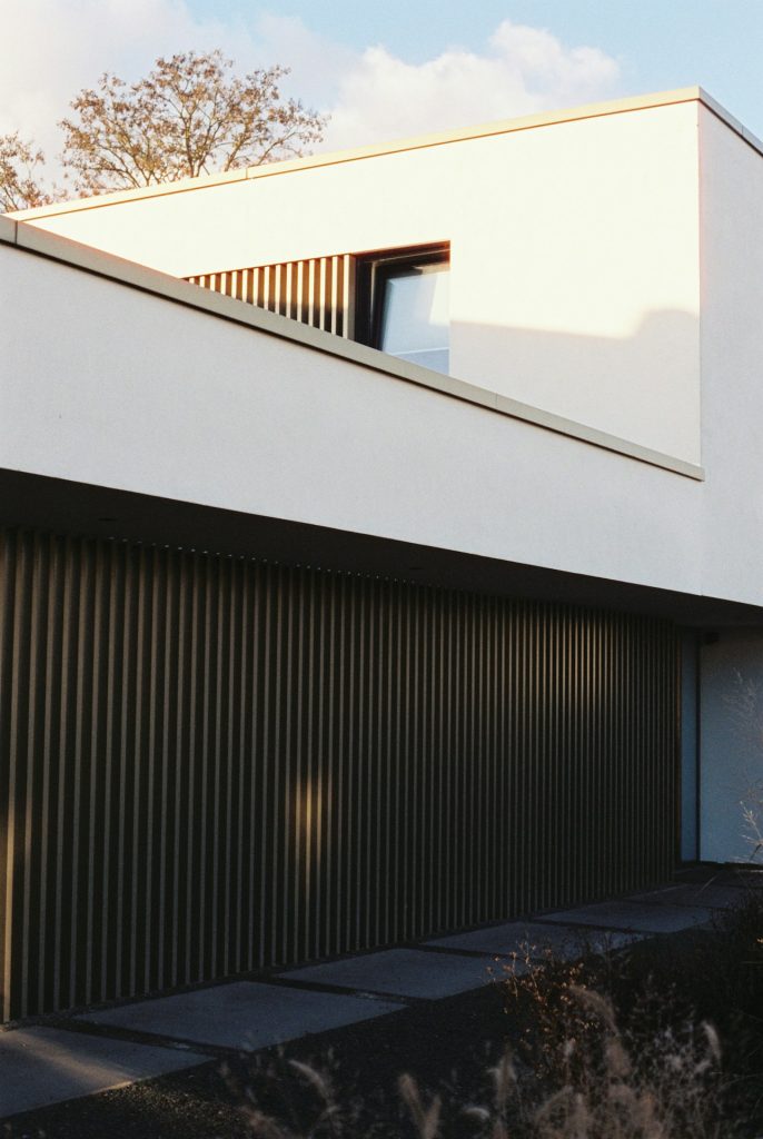 Modern white house with dark vertical siding