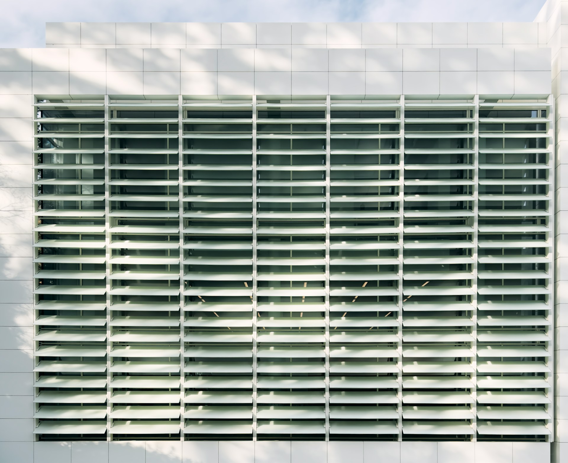 a white building with a large window on the side of it